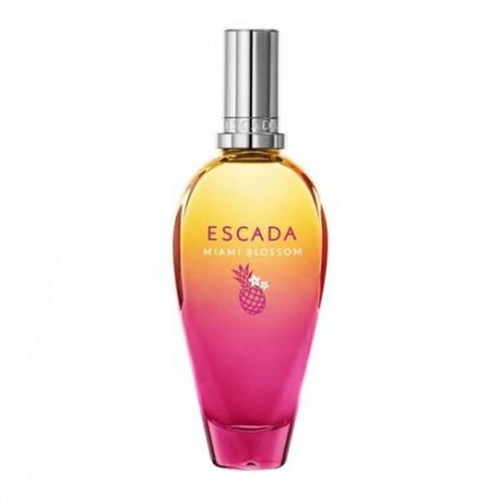 ESCADA, MIAMI BLOSSOM EAU DE TOILETTE. Η φρεσκάδα του ανανά αναμειγνύεται με μια πληθώρα λουλουδιών. Το τέλειο θηλυκό άρωμα για να συνοδεύσεις τις καλοκαιρινές σου στιγμές.
