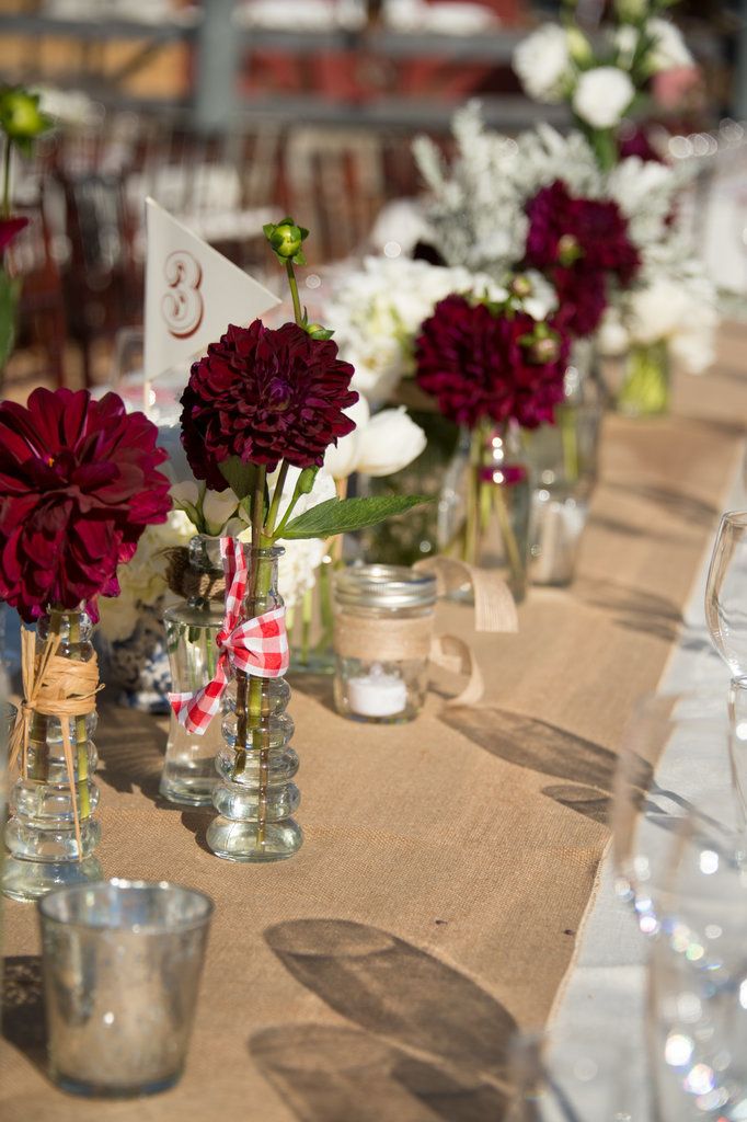 Place single stemmed flowers burlap table runner 82977