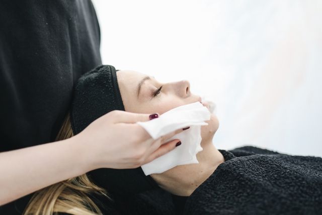 photo of person using a tissue to dry a woman s face 3738344