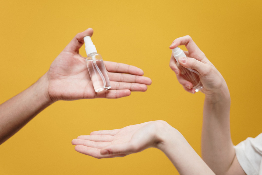 people holding clear glass bottle 3951862