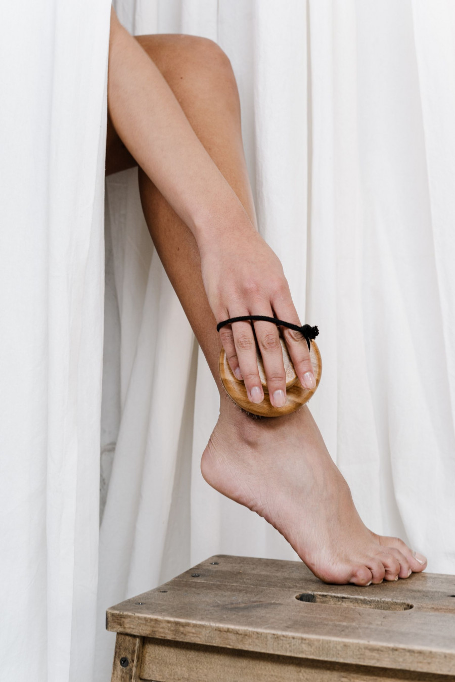 person wearing scrubbing her leg 3737823